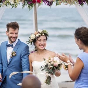 Young couple in a wedding ceremony at the beach