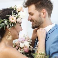 Young couple in a wedding ceremony at the beach